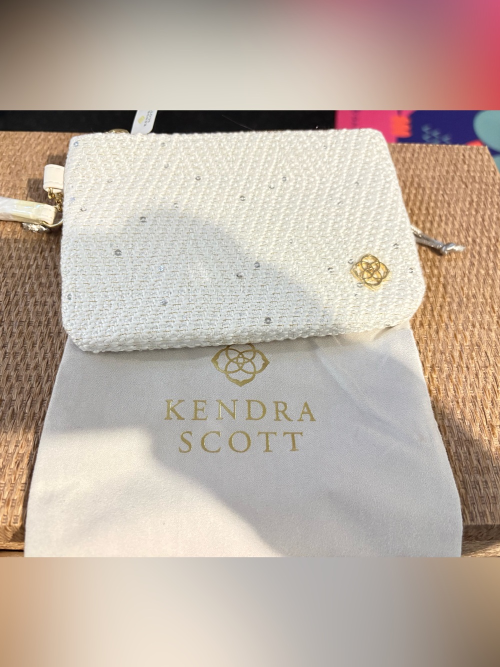 Kendra Scott White Sparkle wristlet with Gold Logo 8”